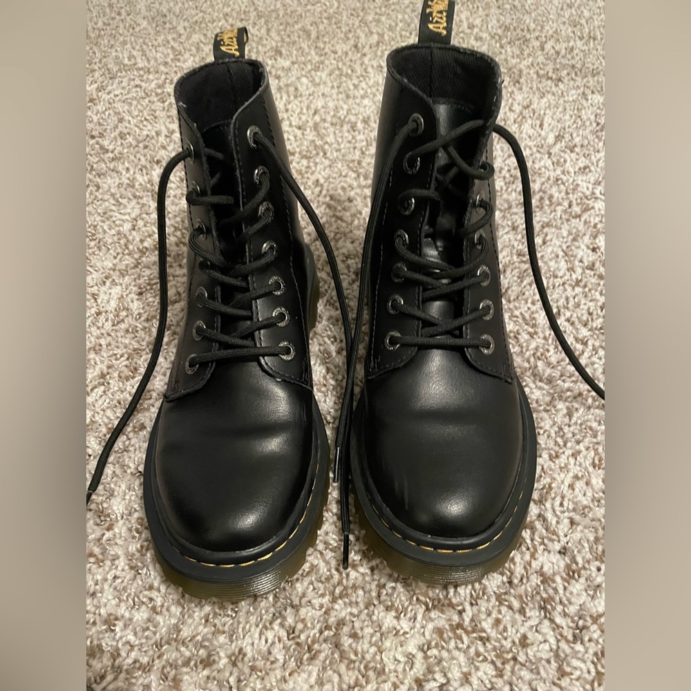 Black pair of women’s lace up leather doc martens
